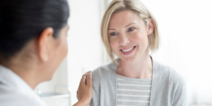 patient smiling with nurse