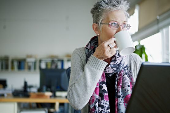 Middle-aged woman drinking tea