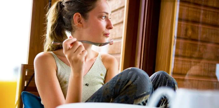 A woman eating breakfast