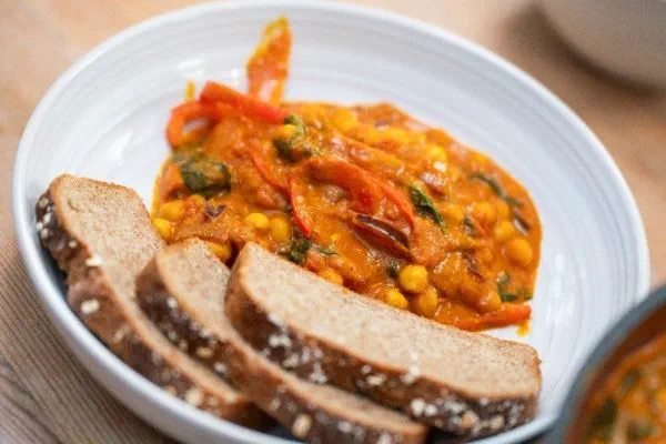 bowl of chickpea curry and crusty bread