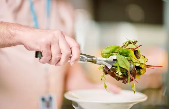 person serving salad
