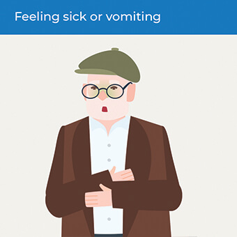 An image showing someone feeling sick, a symptom of a heart attack