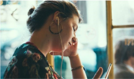 woman using mobile phone and earphone