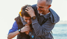 father and son spending quality time on beach