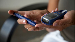 person using a glucometer