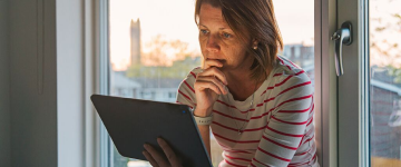 A person looking at a tablet