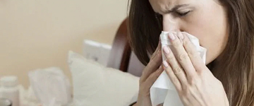 cleaning hands with hygiene spray