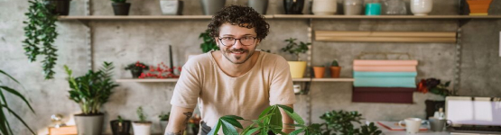 happy adult taking care of plants