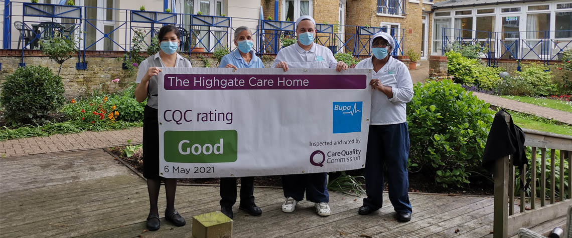 Highgate employees holding CQC banner