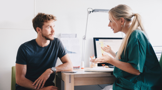 doctor explaining to patient