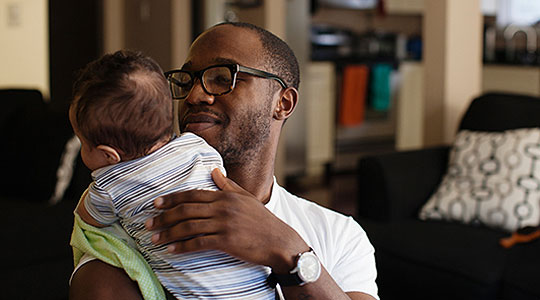 Man holding a baby