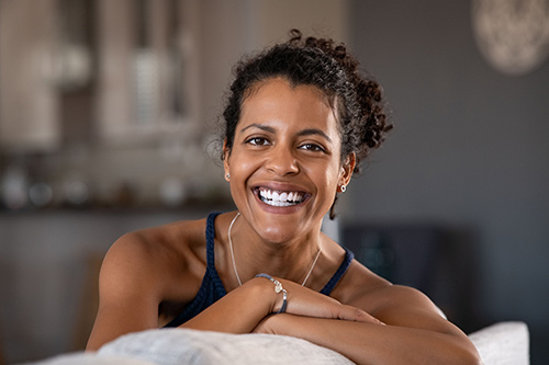 Smiling woman on a sofa