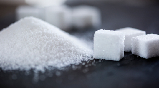 Sugar cubes and mound of sugar