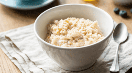 Popcorn being poured into a bowl