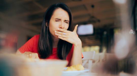 Woman having problems biting food