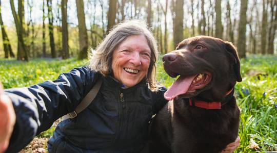 Woman taking a selfie with her dog