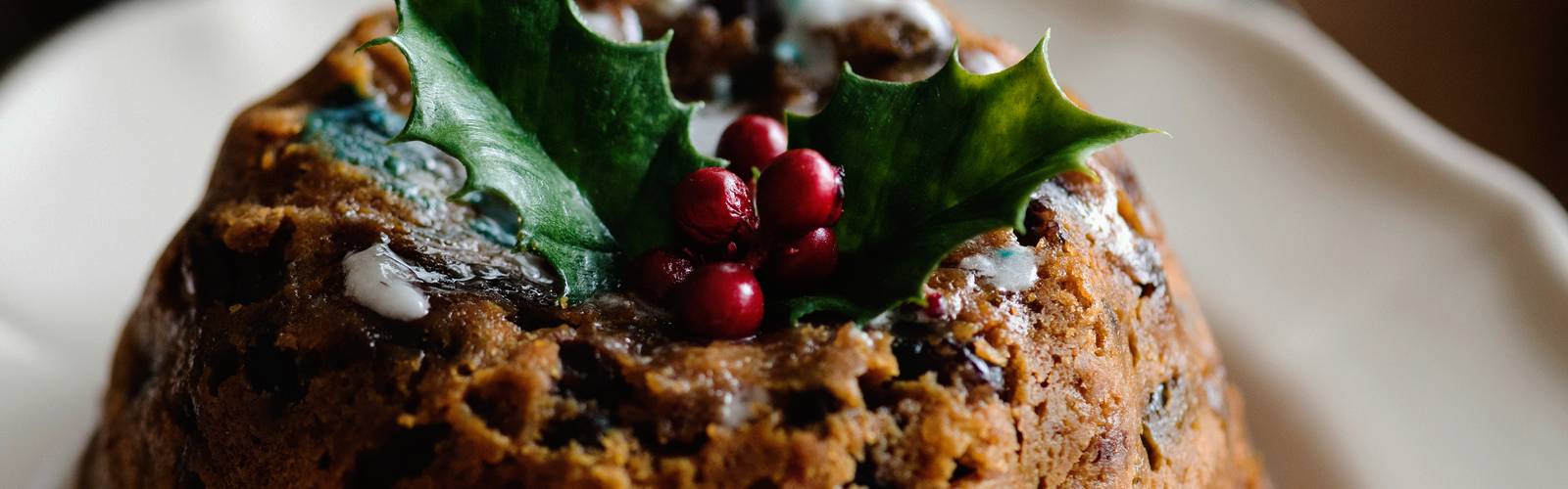 Sugar free Christmas pudding with holly sprig on top