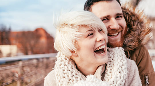 Photo of a smiling couple hugging