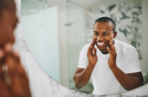 Man smiling in the mirror