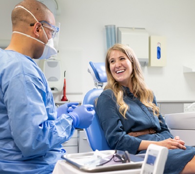 Happy patient during a consultation with a Bupa Dental Care dentist in practice