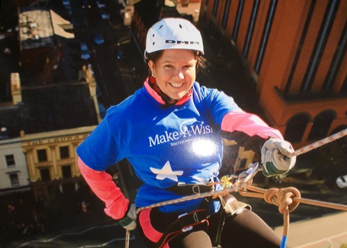 Practice manager, Abbe Mackenzie, abseiling down the Europa in Belfast