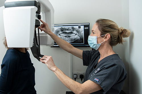Dentist performing a oral scan on a patient at Moreton Dental Care