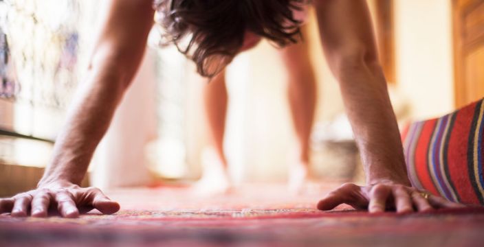Man doing yoga on mat