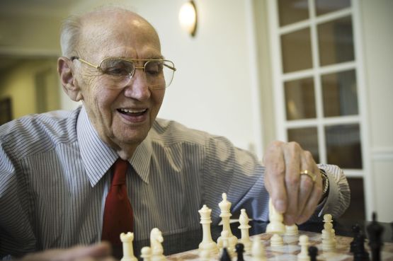 Older man playing chess