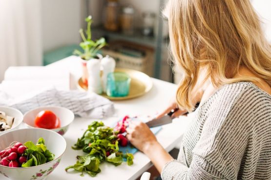 A woman making a salad