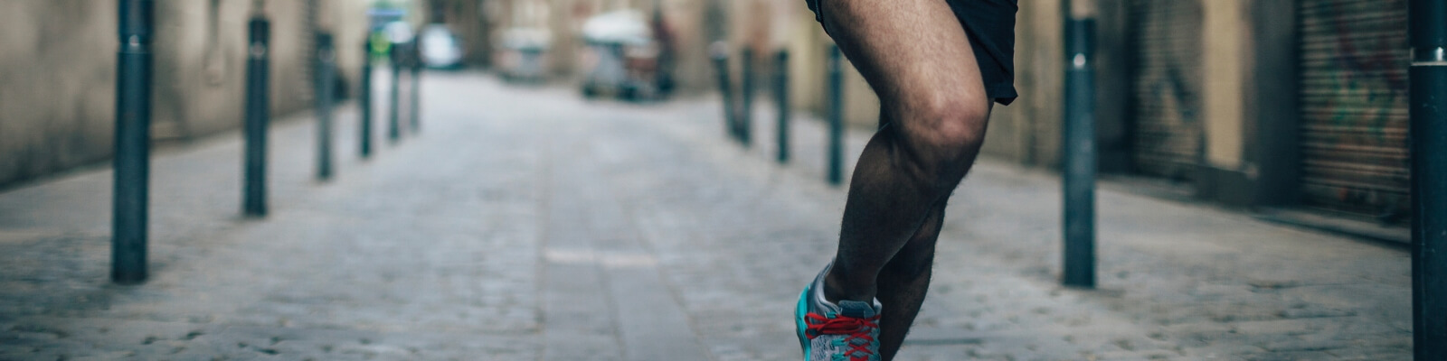 Man running with knee in focus
